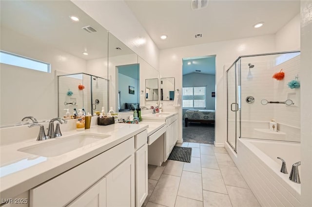 4364 Contour Bend Ave, North Las Vegas, NV 89084 - ensuite bathroom featuring double vanity, a shower stall, plenty of natural light, a garden tub, and recessed lighting