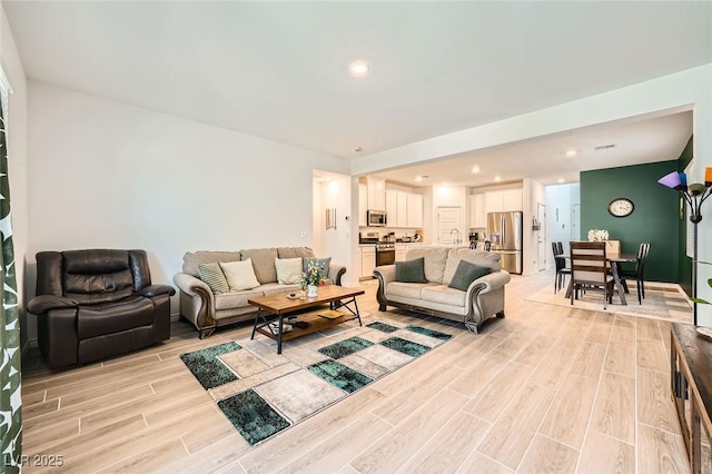 4364 Contour Bend Ave, North Las Vegas, NV 89084 - living room with light wood-type flooring and recessed lighting