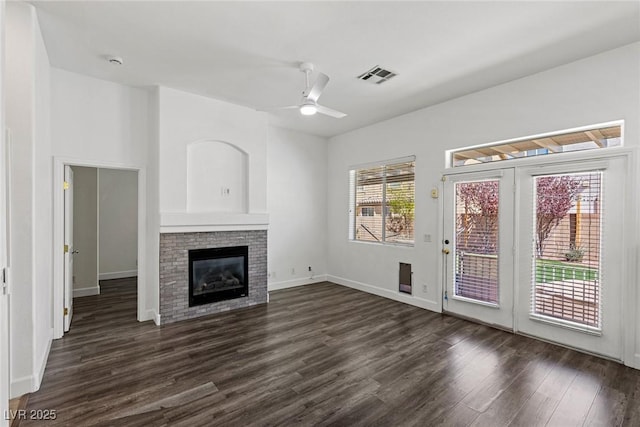 11484 Roncat Ct, Las Vegas, NV 89141 - unfurnished living room featuring dark wood-style floors, a ceiling fan, and a fireplace