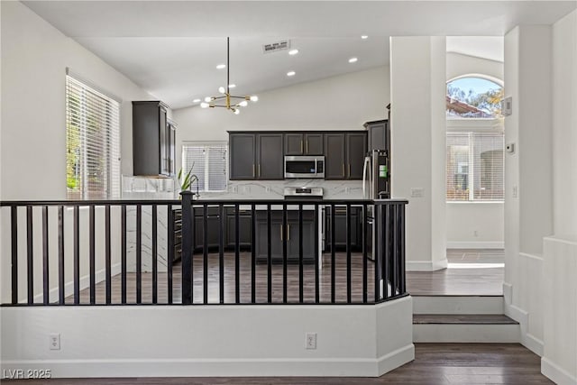 11484 Roncat Ct, Las Vegas, NV 89141 - kitchen with stainless steel appliances, a chandelier, plenty of natural light, dark wood-style floors, and recessed lighting