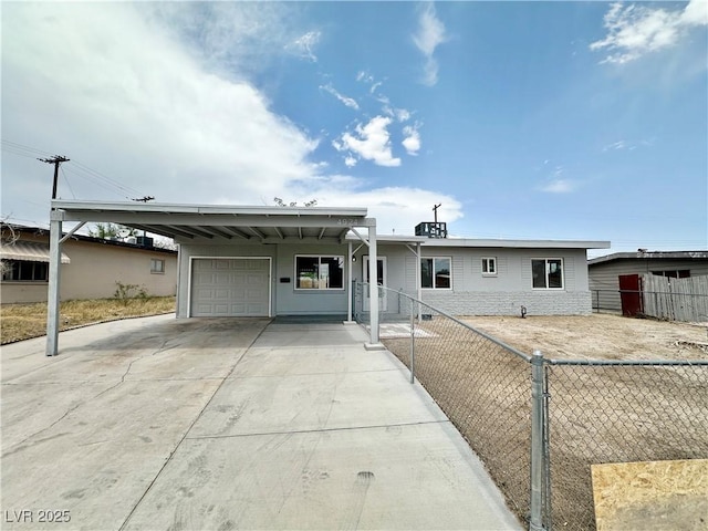 4924 Carmen Blvd, Las Vegas, NV 89108 - ranch-style house featuring a carport, driveway, and a garage