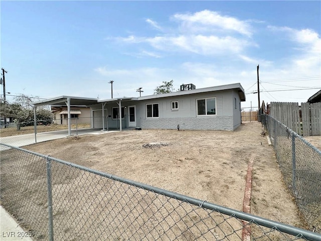 4924 Carmen Blvd, Las Vegas, NV 89108 - view of front of home with a fenced backyard and an attached carport
