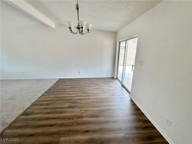 4924 Carmen Blvd, Las Vegas, NV 89108 - unfurnished dining area featuring a chandelier, a textured ceiling, and dark wood-style flooring