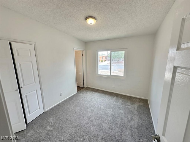 4924 Carmen Blvd, Las Vegas, NV 89108 - unfurnished bedroom featuring carpet floors, a textured ceiling, and a closet