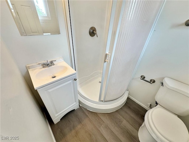 4924 Carmen Blvd, Las Vegas, NV 89108 - full bathroom featuring a stall shower, vanity, and wood finished floors