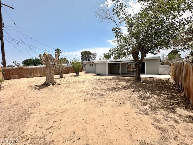 4924 Carmen Blvd, Las Vegas, NV 89108 - fenced backyard with a patio area