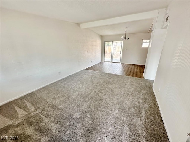 4924 Carmen Blvd, Las Vegas, NV 89108 - carpeted empty room with baseboards and a chandelier