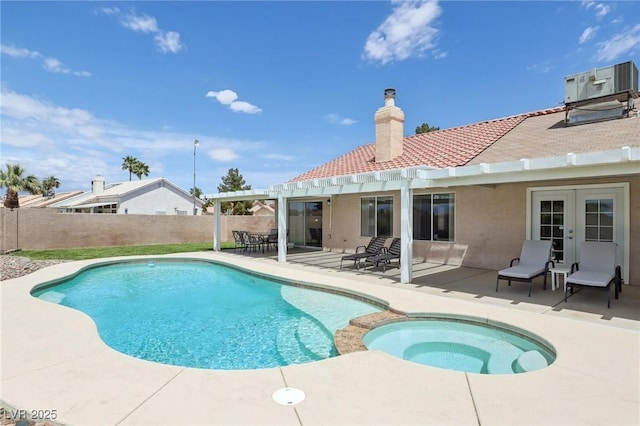 4753 Carefree Dr, Las Vegas, NV 89122 - view of swimming pool featuring a pergola, a fenced backyard, a patio area, french doors, and a pool with connected hot tub