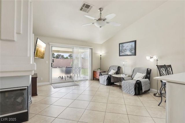 4753 Carefree Dr, Las Vegas, NV 89122 - living room with a ceiling fan, lofted ceiling, and light tile patterned flooring