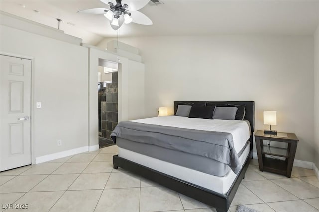 4753 Carefree Dr, Las Vegas, NV 89122 - bedroom featuring light tile patterned flooring, vaulted ceiling, and a ceiling fan