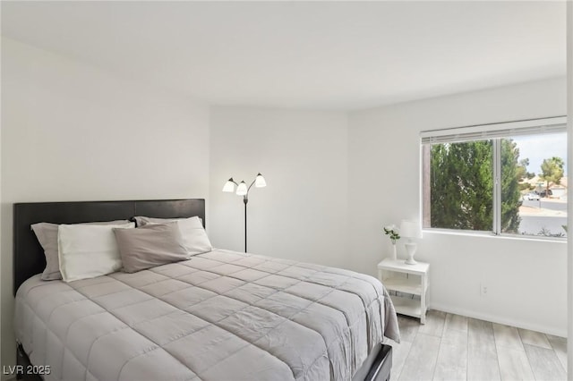 4753 Carefree Dr, Las Vegas, NV 89122 - bedroom featuring wood finished floors and baseboards