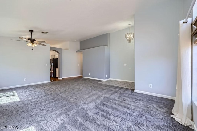 8309 Windrush Ave, Las Vegas, NV 89117 - unfurnished room with dark colored carpet, ceiling fan, arched walkways, and a chandelier