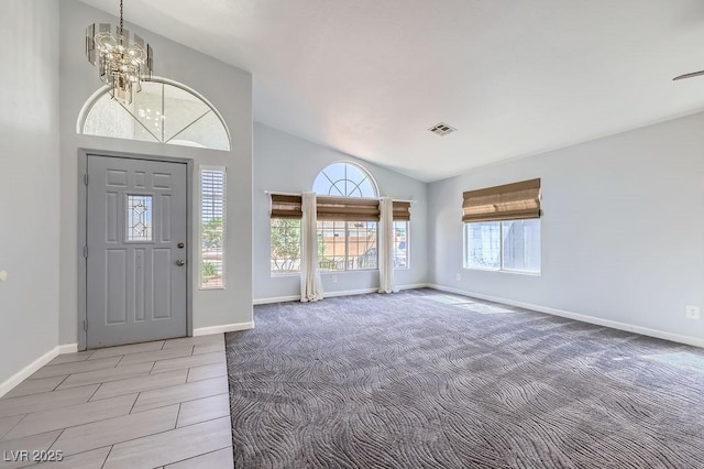 8309 Windrush Ave, Las Vegas, NV 89117 - foyer entrance featuring a chandelier, light carpet, and high vaulted ceiling