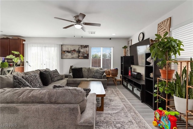 4976 Quiet Morning St, Las Vegas, NV 89122 - living area featuring ceiling fan and light wood-style flooring
