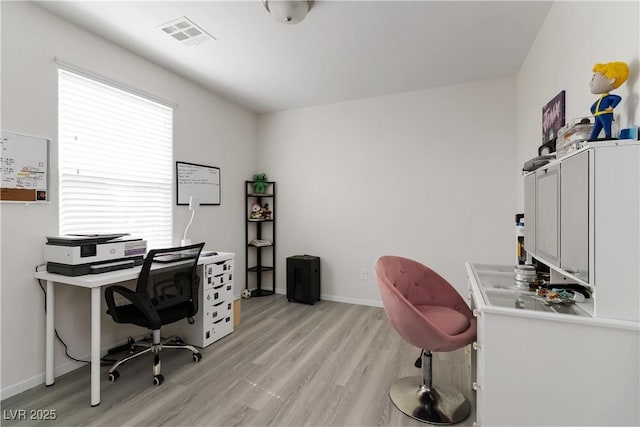 4976 Quiet Morning St, Las Vegas, NV 89122 - home office with light wood finished floors