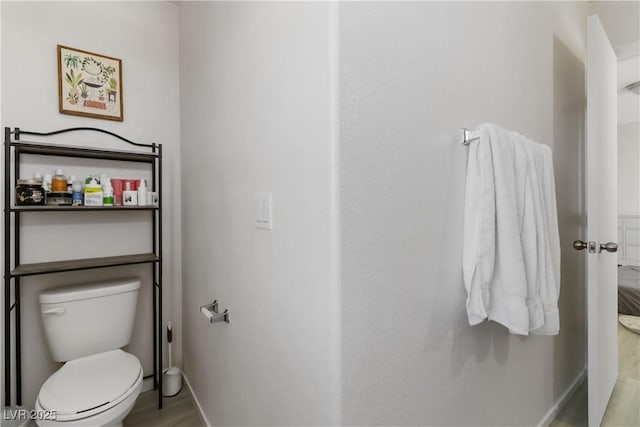 4976 Quiet Morning St, Las Vegas, NV 89122 - bathroom featuring toilet and wood finished floors