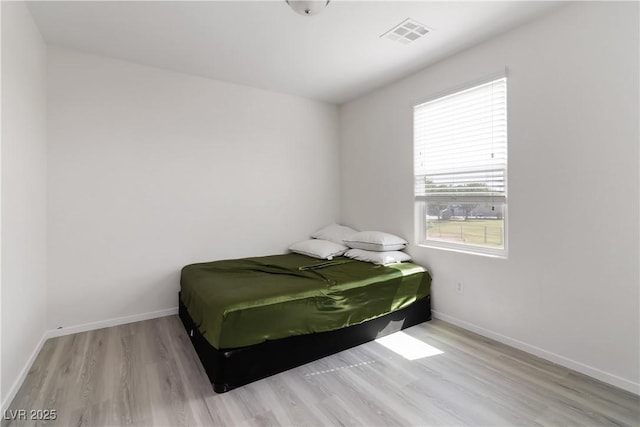 4976 Quiet Morning St, Las Vegas, NV 89122 - bedroom featuring wood finished floors and baseboards