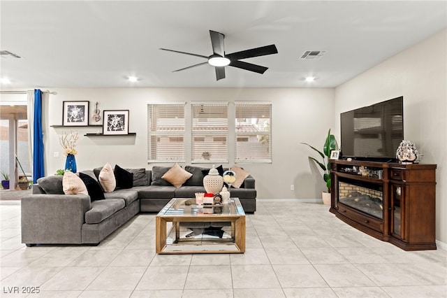 7502 Lush Oasis Ave, Las Vegas, NV 89113 - living room with a ceiling fan, light tile patterned floors, and recessed lighting