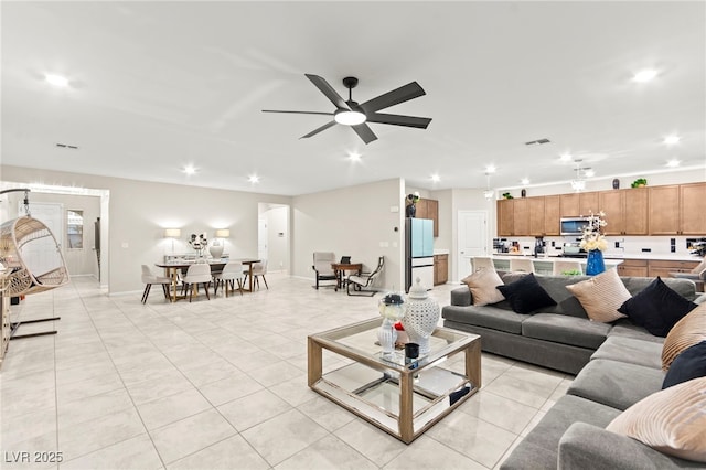 7502 Lush Oasis Ave, Las Vegas, NV 89113 - living area with recessed lighting, light tile patterned floors, and a ceiling fan