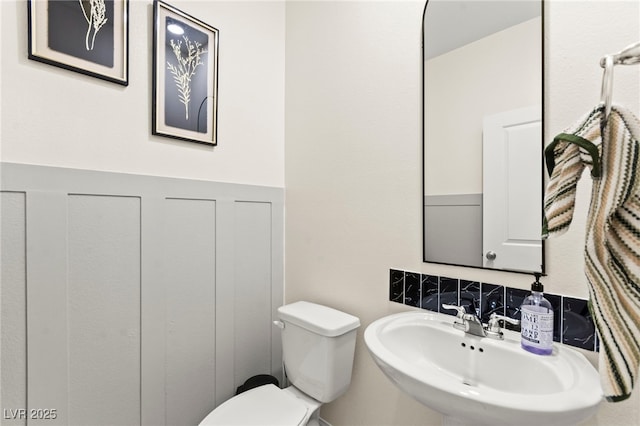 7502 Lush Oasis Ave, Las Vegas, NV 89113 - half bathroom with a sink and toilet