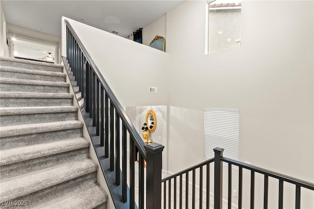 7502 Lush Oasis Ave, Las Vegas, NV 89113 - stairs featuring a ceiling fan