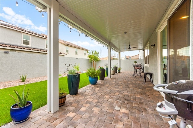 7502 Lush Oasis Ave, Las Vegas, NV 89113 - fenced backyard featuring a patio area, a ceiling fan, and outdoor dining space