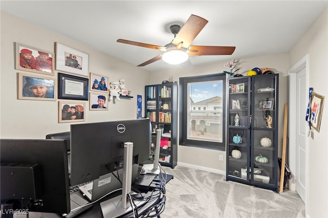 7502 Lush Oasis Ave, Las Vegas, NV 89113 - carpeted home office featuring a ceiling fan and baseboards