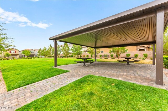 7502 Lush Oasis Ave, Las Vegas, NV 89113 - view of home's community with a yard, a patio area, and a residential view