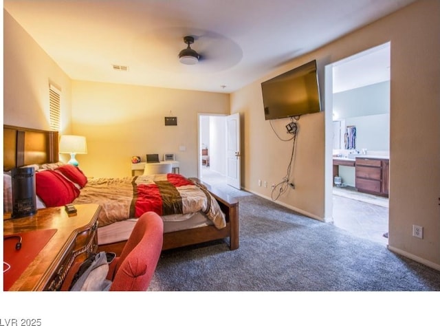 1557 Blue Sierra Ct, Henderson, NV 89074 - carpeted bedroom with ensuite bath and a ceiling fan