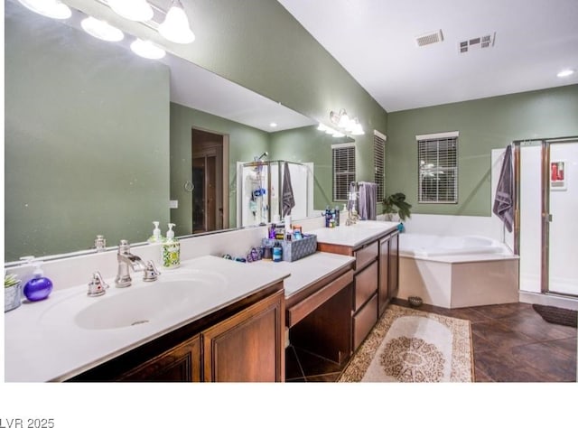 1557 Blue Sierra Ct, Henderson, NV 89074 - bathroom with a stall shower, double vanity, a garden tub, and tile patterned floors