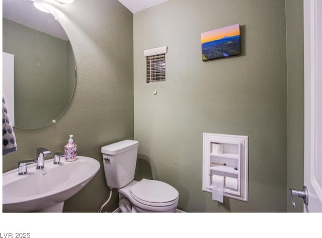 1557 Blue Sierra Ct, Henderson, NV 89074 - bathroom featuring toilet and a sink