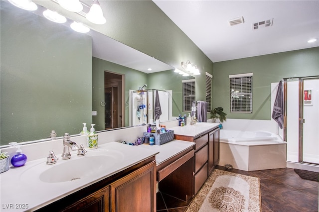 1557 Blue Sierra Ct, Henderson, NV 89074 - full bathroom featuring a shower stall, vanity, and a garden tub
