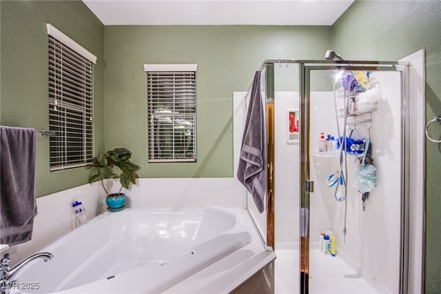 1557 Blue Sierra Ct, Henderson, NV 89074 - full bathroom featuring a stall shower, a garden tub, and a textured wall