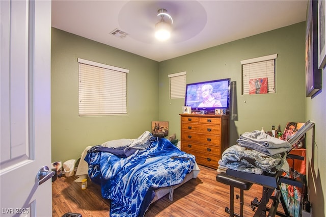 1557 Blue Sierra Ct, Henderson, NV 89074 - bedroom featuring wood finished floors and ceiling fan