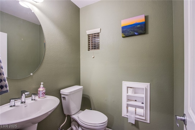 1557 Blue Sierra Ct, Henderson, NV 89074 - half bath featuring a sink and toilet