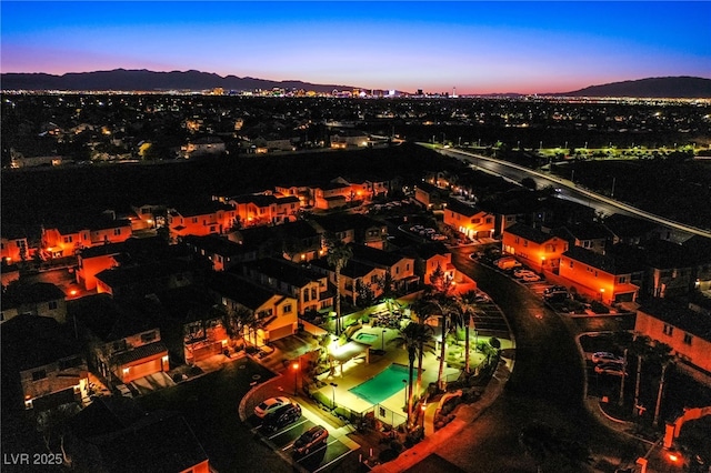 1557 Blue Sierra Ct, Henderson, NV 89074 - aerial view at dusk of a mountain view and view of pool