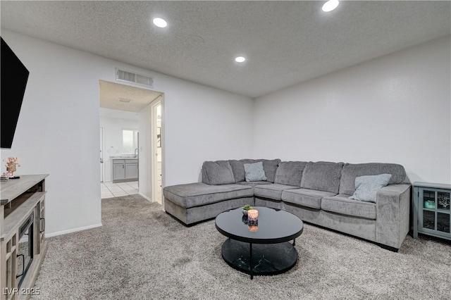 7066 Burcot Ave Unit 59, Las Vegas, NV 89156 - living area featuring carpet flooring, recessed lighting, and a textured ceiling