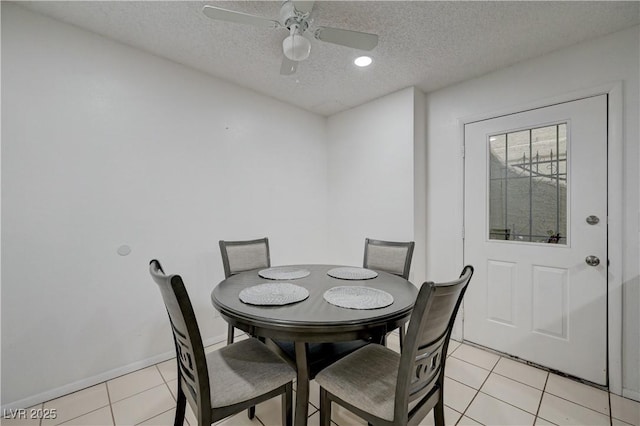 7066 Burcot Ave Unit 59, Las Vegas, NV 89156 - dining area with a textured ceiling, light tile patterned flooring, and a ceiling fan