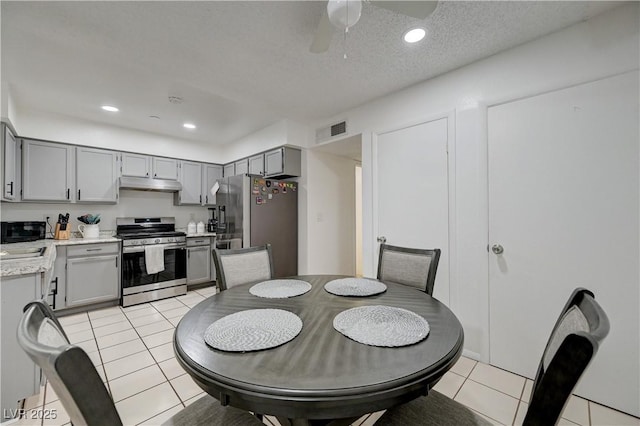 7066 Burcot Ave Unit 59, Las Vegas, NV 89156 - dining area featuring light tile patterned floors, a ceiling fan, recessed lighting, and a textured ceiling