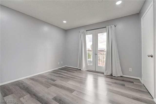 7066 Burcot Ave Unit 59, Las Vegas, NV 89156 - unfurnished room featuring french doors, wood finished floors, and recessed lighting