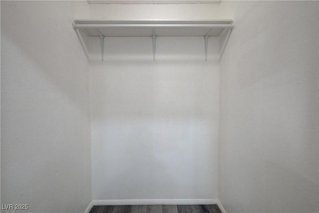 7066 Burcot Ave Unit 59, Las Vegas, NV 89156 - walk in closet with dark wood-style flooring