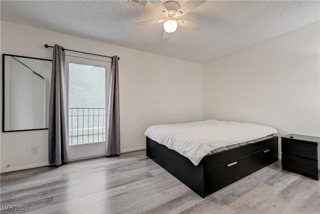 7066 Burcot Ave Unit 59, Las Vegas, NV 89156 - bedroom featuring light wood finished floors, a textured ceiling, and ceiling fan