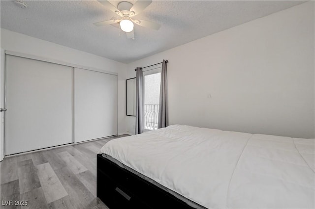 7066 Burcot Ave Unit 59, Las Vegas, NV 89156 - bedroom featuring light wood-style floors, a closet, a textured ceiling, and ceiling fan