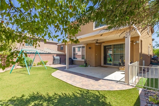 7652 Silver Baron Rd, Las Vegas, NV 89179 - back of house featuring stucco siding, ceiling fan, and a patio