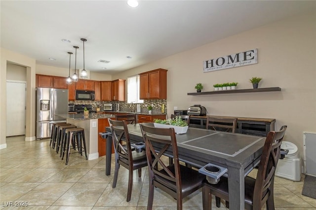 7652 Silver Baron Rd, Las Vegas, NV 89179 - dining space featuring light tile patterned floors and recessed lighting