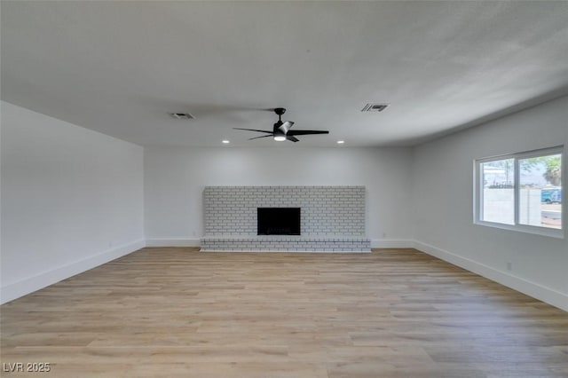 212 View Dr, Las Vegas, NV 89107 - unfurnished living room featuring ceiling fan, recessed lighting, light wood-type flooring, and a fireplace