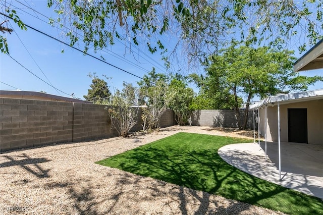 212 View Dr, Las Vegas, NV 89107 - fenced backyard with a patio area