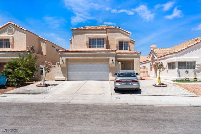 309 Clifton Heights Dr, Las Vegas, NV 89145 - view of front of house with a tile roof, an attached garage, concrete driveway, and stucco siding