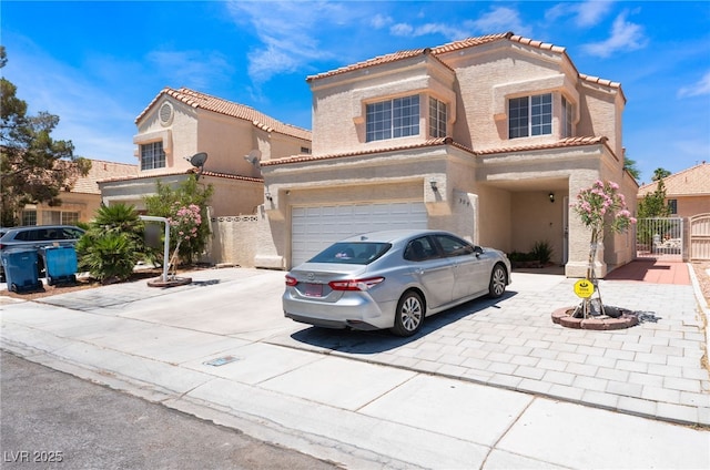 309 Clifton Heights Dr, Las Vegas, NV 89145 - mediterranean / spanish-style house with a gate, driveway, a tiled roof, and a garage