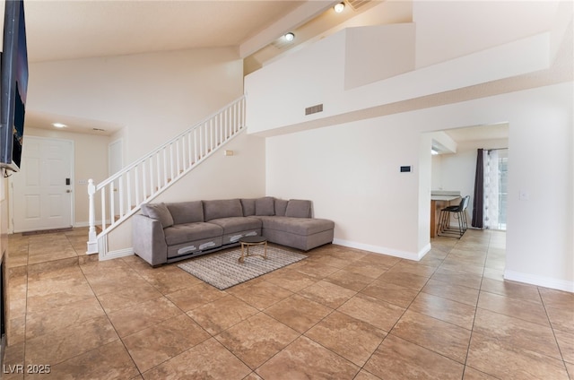 309 Clifton Heights Dr, Las Vegas, NV 89145 - tiled living area with stairs and high vaulted ceiling